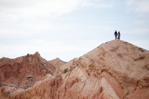 Couple on the top of the mountain. Beautiful mountain landscape. Wildlife of Kyrgyzstan. High quality photo
