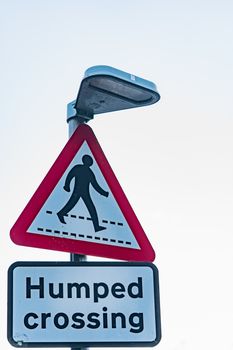 A humped crossing road sign in England