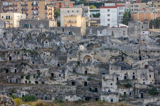 Matera, Italy - September 16, 2019: Panoramic view of Sassi di Matera a historic district in the city of Matera, well-known for their ancient cave dwellings from the Belvedere di Murgia Timone,  Basilicata, Italy 
