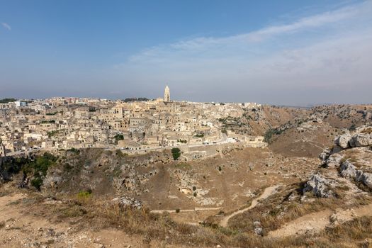 Panoramic view of Sassi di Matera a historic district in the city of Matera, well-known for their ancient cave dwellings from the Belvedere di Murgia Timone,  Basilicata, Italy 