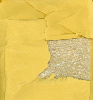 yellow paper and bubble wrap texture useful as a background