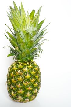 A whole pineapple against a plain white background