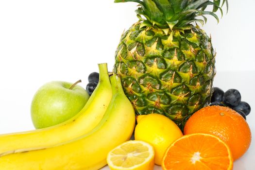 A selection of tropical fruit against a plain white background