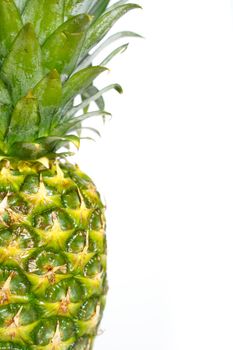 A whole pineapple against a plain white background