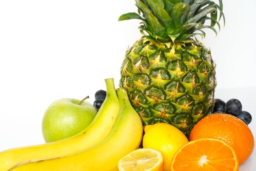 A selection of tropical fruit against a plain white background