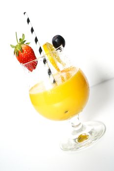 An orange cocktail drink with a party straw against a plain white background