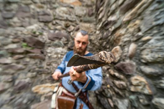 Close up of the ax wielded by a Viking warrior, image with blurred background