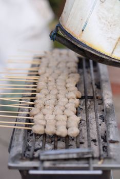 Meatballs are made of pork skewers grilled on a charcoal grill. With an exhaust fan