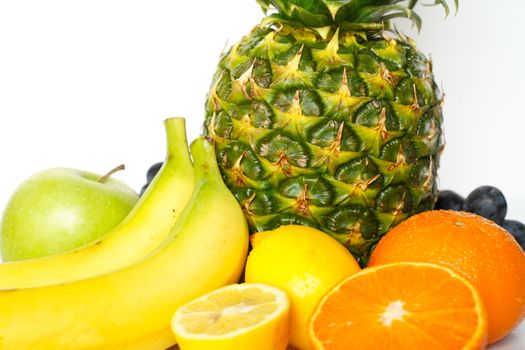 A selection of tropical fruit against a plain white background