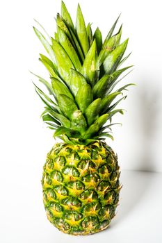 A whole pineapple against a plain white background