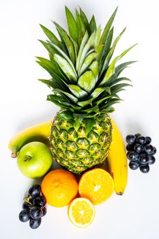 A selection of tropical fruit against a plain white background