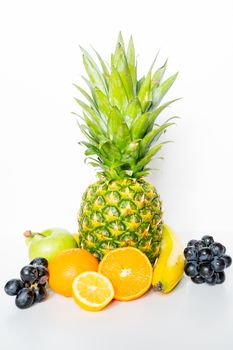 A selection of tropical fruit against a plain white background