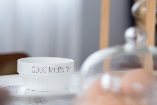bowl with good morning text on table in morning day