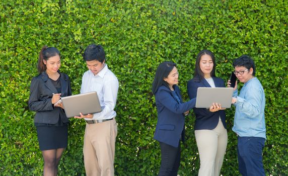 Business People Meeting Corporate Digital Device Connection Concept on tree wall.