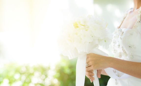 Beautiful wedding bouquet in hands of the bride