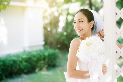 Asian bride at outdoor in a morning.