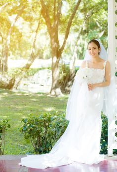 Asian bride at outdoor in a morning.