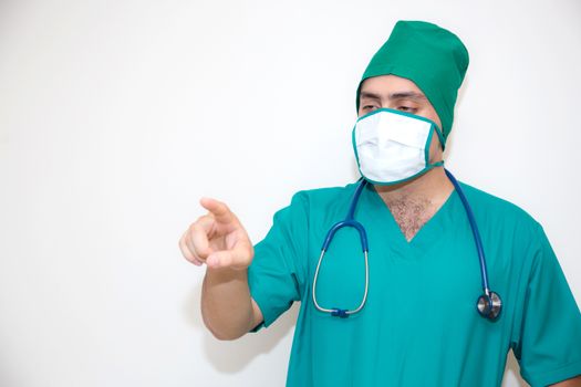 Doctor man with mask pointing on something -  isolated on white background.