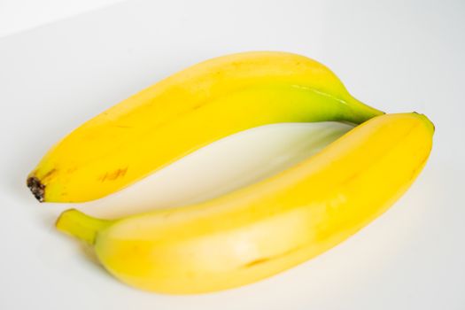 Two bananas against a plain white background