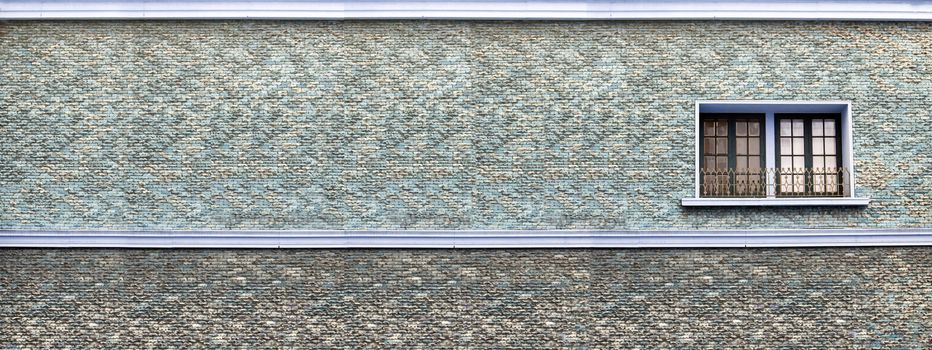 panorama of sand stone brick wall gray blue color and window