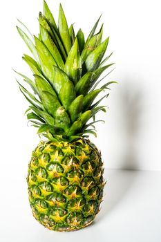 A whole pineapple against a plain white background