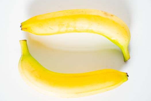 Two bananas against a plain white background