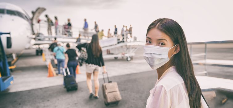 Airport Asian woman tourist boarding plane taking a flight in China wearing face mask. Coronavirus flu virus travel concept banner panorama.