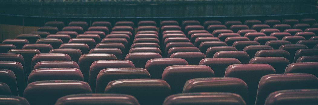 Coronavirus closure of public spaces such as cinemas, theatres, city lockdown. Retail businesses shut down. Banner panoramic background of empty concert seats.