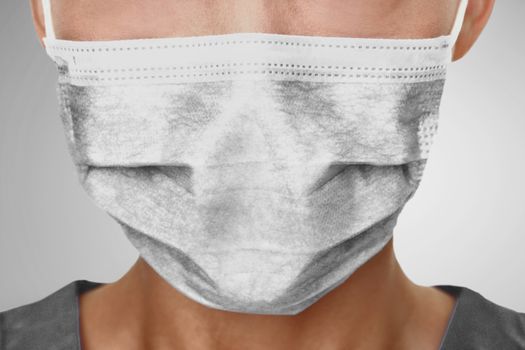 Doctor wearing protection face mask against coronavirus. Medical staff preventive PPE.