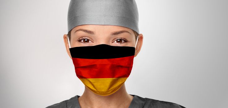 German flag on Asian doctor woman wearing mask. COVID-19 outbreak in Germany. Graphic design illustration print on medical PPE.