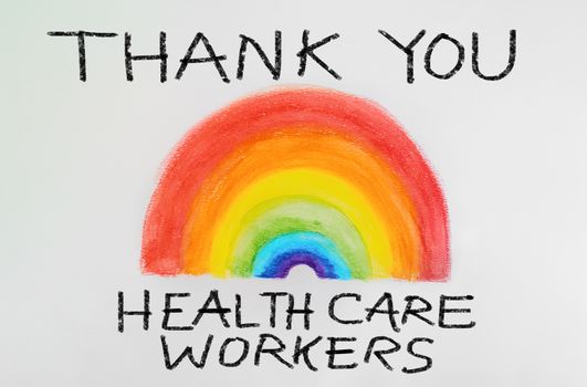 THANK YOU Healthcare workers rainbow drawing sign as appreciation support message for doctors and nurses fighting COVID-19 at hospitals. Coronavirus appreciation.