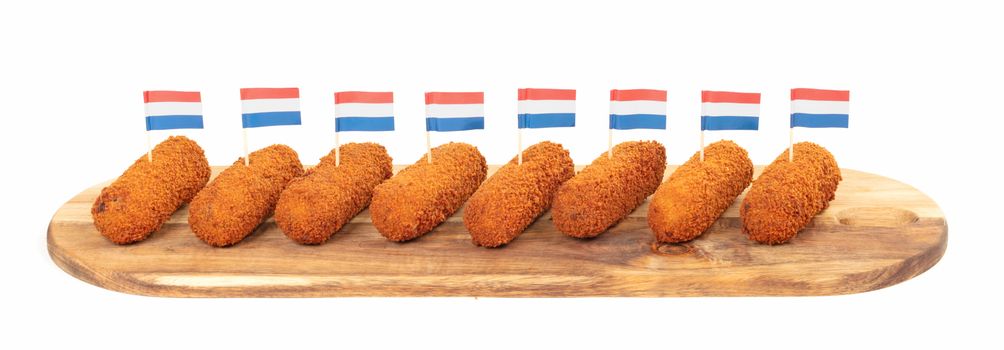 Brown crusty dutch kroketten on a serving tray, isolated on a white background