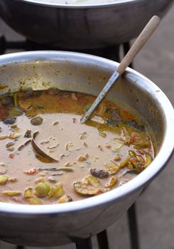 Chicken Curry In a large bowl and with dippers inside for sale.