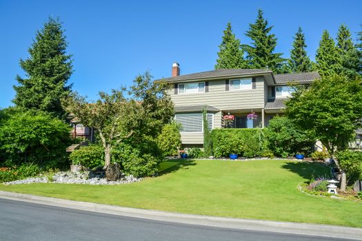 Nicely decorated front yard of residential house on the street