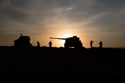 War Concept. Military silhouettes fighting scene on war fog sky background, World War Soldiers Silhouette Below Cloudy Skyline sunset. Selective focus