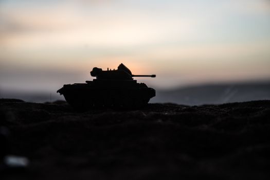 War Concept. Military silhouettes fighting scene on war fog sky background, World War Soldiers Silhouette Below Cloudy Skyline sunset. Selective focus