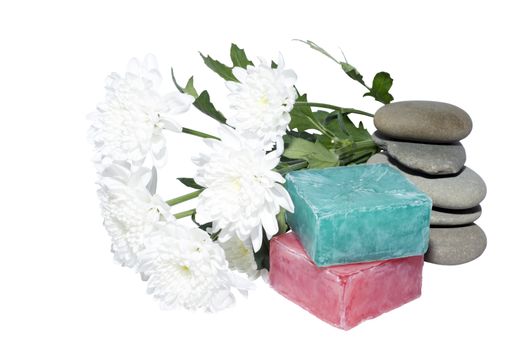 soaps off various shades with grey sone pebbles and flowers