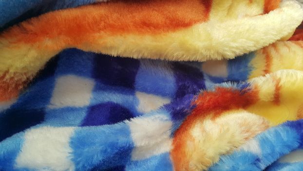 Closeup view of colorful soft blanket for winter season