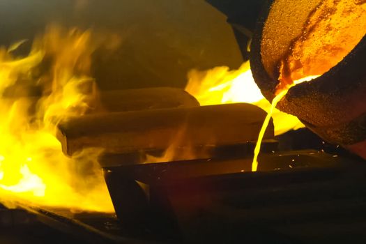 A large bowl of molten metal at a steel mill. Steel production.