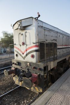 Large diesel railway locomotive engine at a station platform