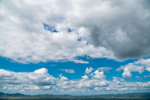 Cloudy skies and mountains in the moist forest