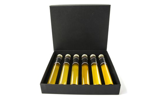 samples of six different whiskeys as a tasting collection on white background