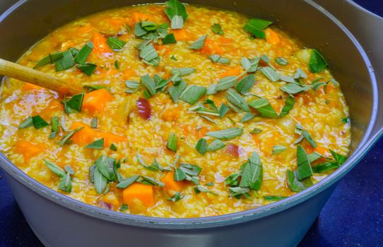 Risotto, an Italian rice dish, made with pumpkin and sage