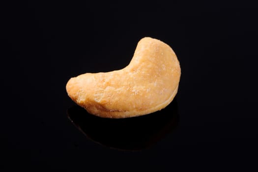 Salted Cashew Nut on a black background