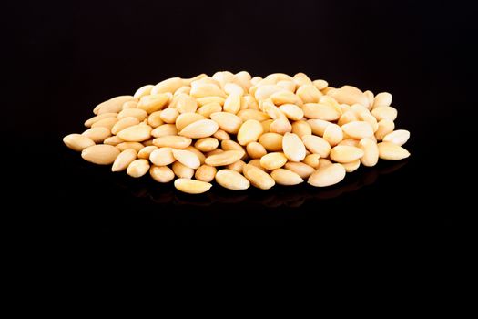 Blanched Almonds on a black background