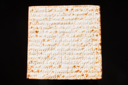 Matzo - A traditional Jewish Passover bread on a black background