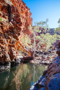A waterhole at Serpentine Gorge on a clear winter's day near Alice Springs, Northern Territory, Australia