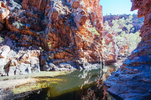 A waterhole at Serpentine Gorge on a clear winter's day near Alice Springs, Northern Territory, Australia