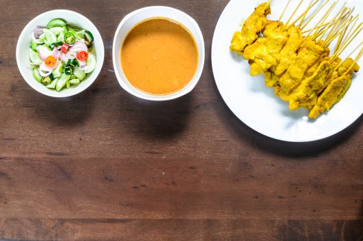 Pork Satay Set has cooked and preparing to enjoying for lunch on the wood table.