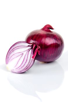 Red onion and half slice on white background with reflect.